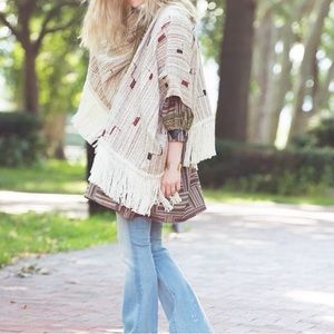 Cotton handwoven fringed poncho from Ulla Johnson